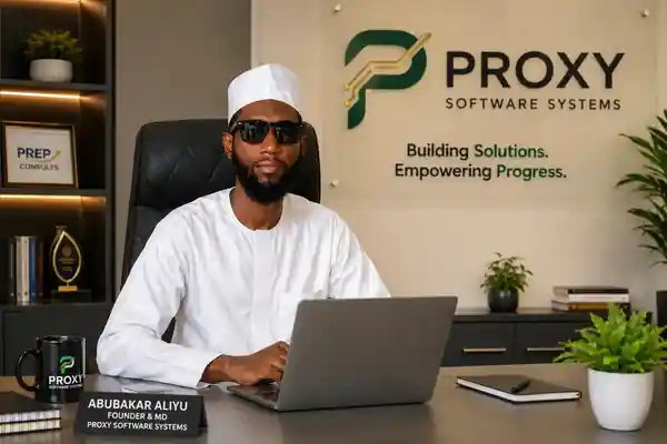 Mr. Abubakar Aliyu, Founder and Managing Director of Proxy Software Systems, in white traditional Hausa attire in his professional office